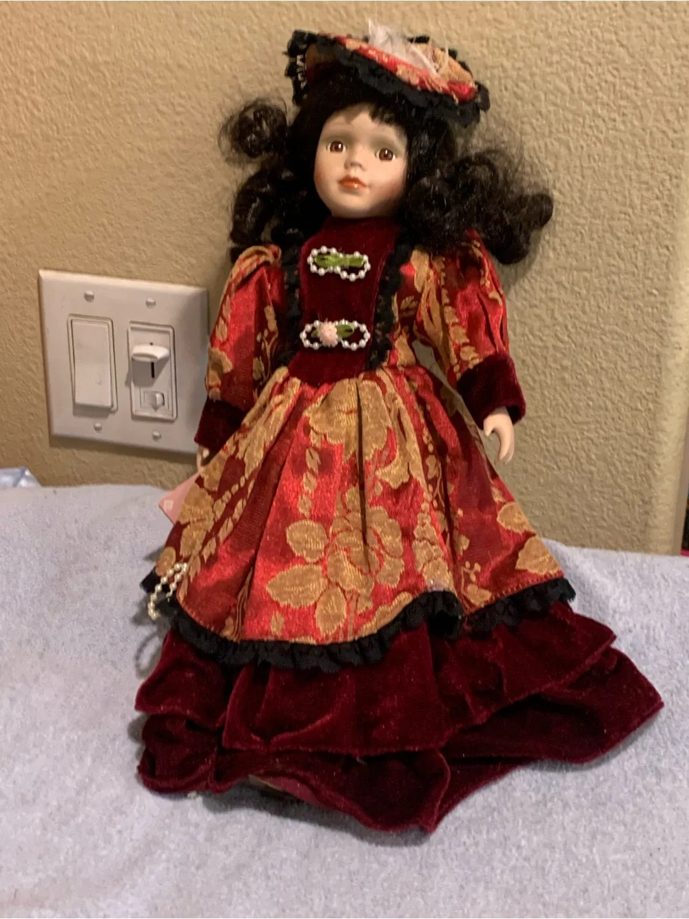 Vintage-Style Porcelain Doll in Burgundy and Gold Floral Dress